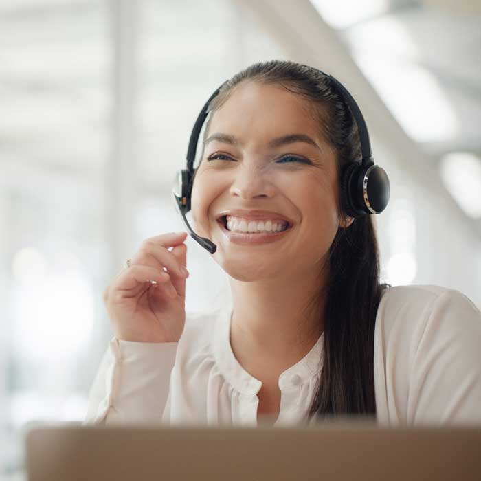 smiling woman on support team
